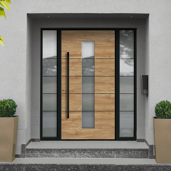Modern wooden front door with glass side panels and a tall vertical black handle, set in a gray entryway with potted shrubs on either side.